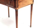 a small wooden table with two drawers on it