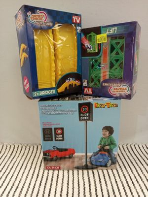 two boxes of toys that are sitting on top of each other