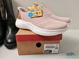 a pair of shoes that are on top of a box