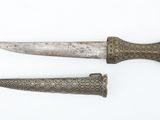 two old knives are laying side by side on a white surface