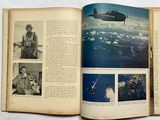 an open book with a picture of a plane in the sky