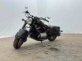 a black motorcycle that is parked in a parking lot