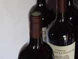three bottles of wine sitting next to each other on a table