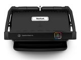a close up of a black grill on a white surface
