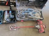 une boîte à outils contenant des outils, posée sur le sol