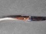 a knife that is laying on a table