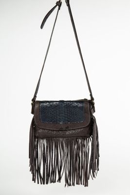 a brown and blue purse with fringes hanging from a hook