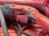 a red tool that is sitting on top of a red box