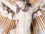 a statue of jesus on a cross on a table