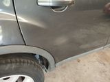 a car that has a door handle on the side of it