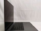 an open laptop computer sitting on top of a white surface