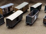six toy trains that are sitting on a table
