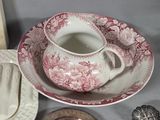 a cup and saucer sitting on a table next to a plate