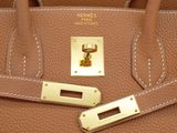 a brown purse with a gold lock on it
