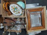 a box of assorted items sitting on the floor