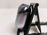 a close up of a small black object on a table