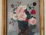un tableau de fleurs dans un vase sur le mur
