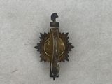 a picture of a small metal object on a snow covered surface
