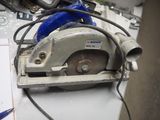 someone is using a circular saw to cut a piece of metal