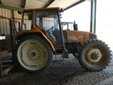 a tractor that is parked inside of a building