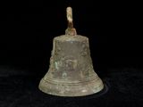 an image of a bronze bell on a black background