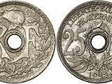 a close up of two silver coins on a white background