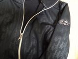 black leather jacket with black and white logo on the sleeves