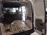 an image of the inside of a van with the door open