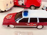 three toy cars that are sitting on a table