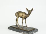 an image of a bronze statue of a deer on a marble base