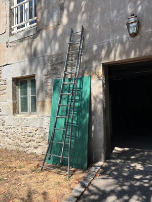 a ladder leaning up against the side of a building