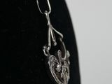 a close up of a necklace on a mannequin head