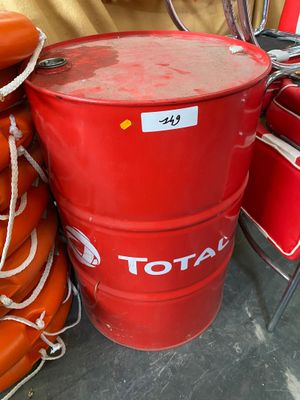 a red barrel sitting next to a stack of life preservers