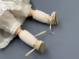 a doll that is laying down on the floor