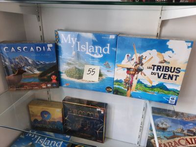 many board games on display in a glass case