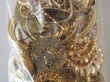 a bag full of gold and silver jewelry on a table