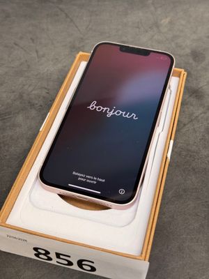an iphone x in a box with the box open on the floor