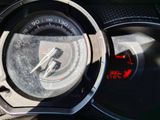 a close up of a car dashboard with a speedometer