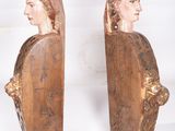 pair of antique carved wood bookends of a man and a woman