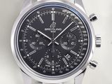 the watch is black and has a stainless steel band