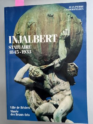 a book with a picture of a statue holding a ball