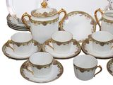 a lot of plates and cups and saucers on the table