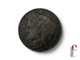 a close up of a coin with a crown on it