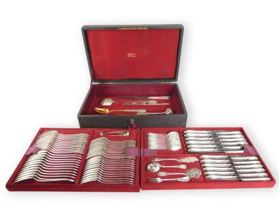 a red box with silverware in it on a white surface