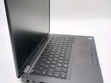 a laptop that is open on a white surface