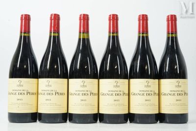 six bottles of red wine are lined up in a row