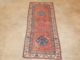 an old rug is laying on the floor in a room