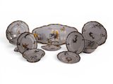 a group of plates and bowls on a white surface