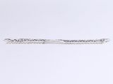 a close up of a silver bracelet on a white surface