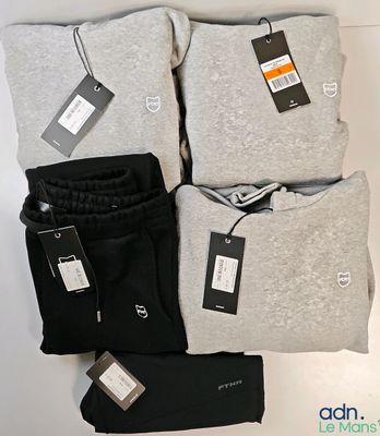 three pairs of men ' s grey and black sweatpantss and a pair of black sweatpants